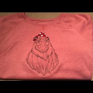 Embroidered chicken sweatshirt.